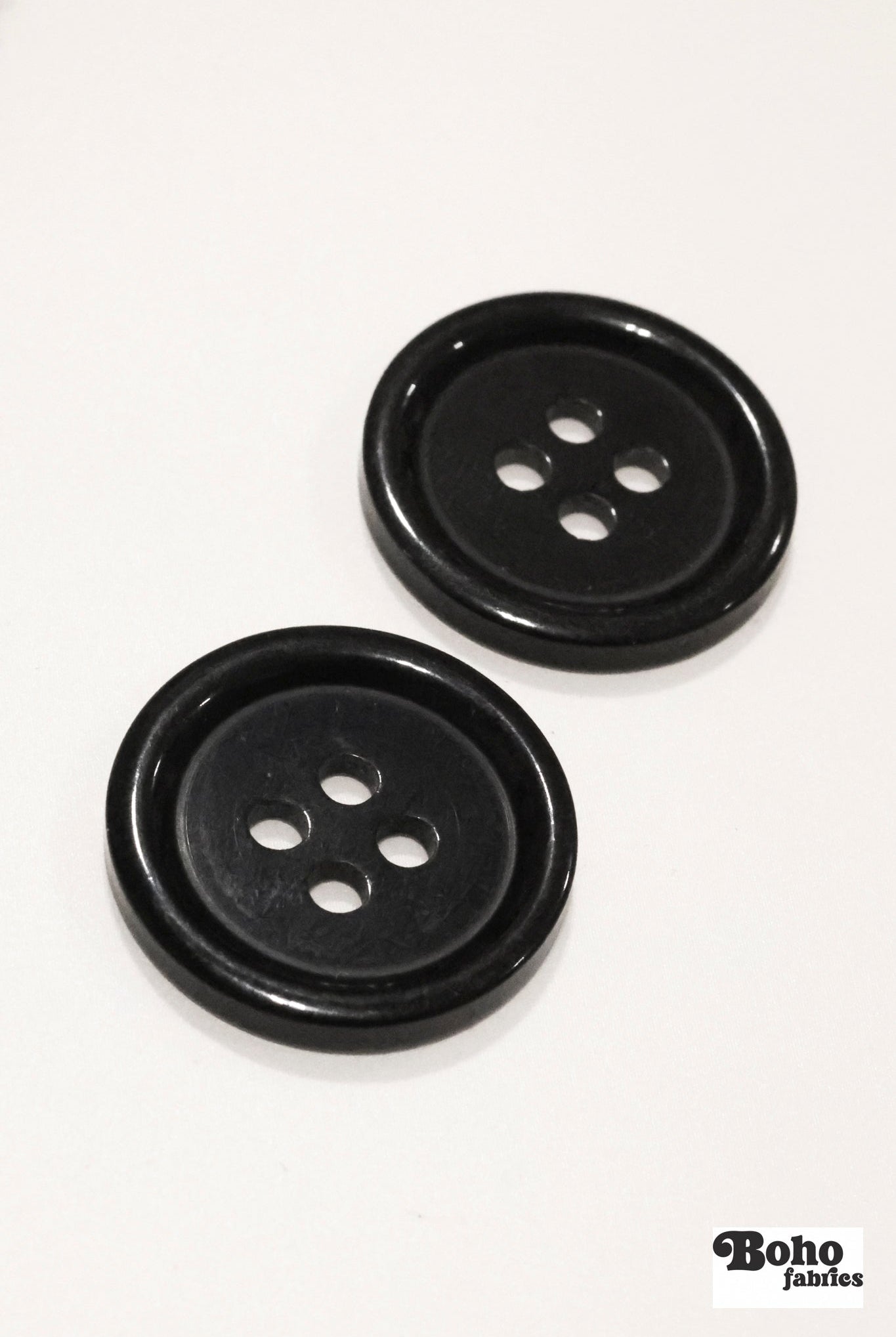 Black, 4 Hole Plastic Buttons. 28L (18mm/ 11/16") Sold per Package of 12. - Boho Fabrics - Buttons & Snaps