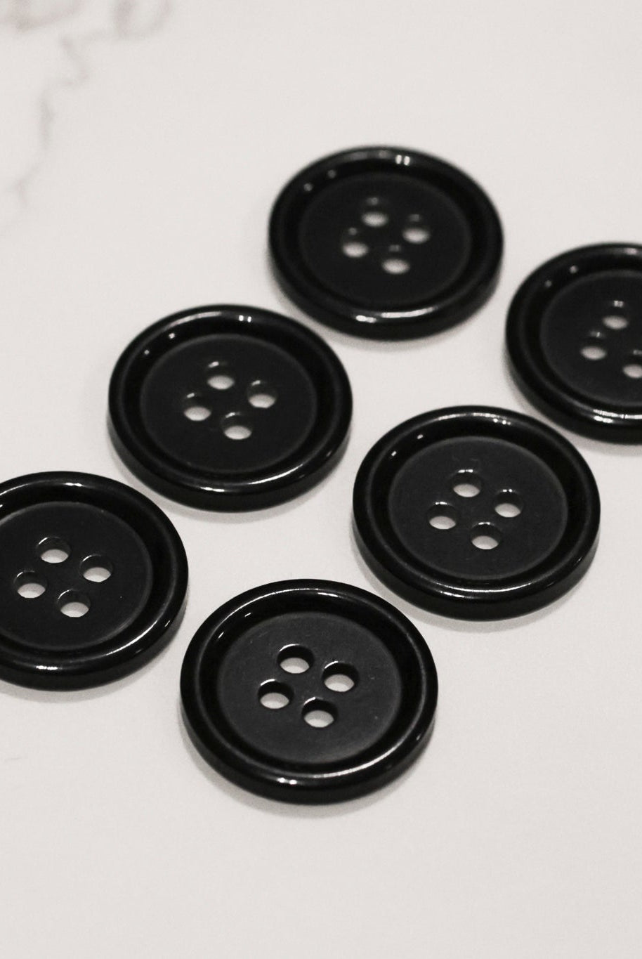 Black, 4 Hole Plastic Buttons. 28L (18mm/ 11/16") Sold per Package of 12. - Boho Fabrics - Buttons & Snaps
