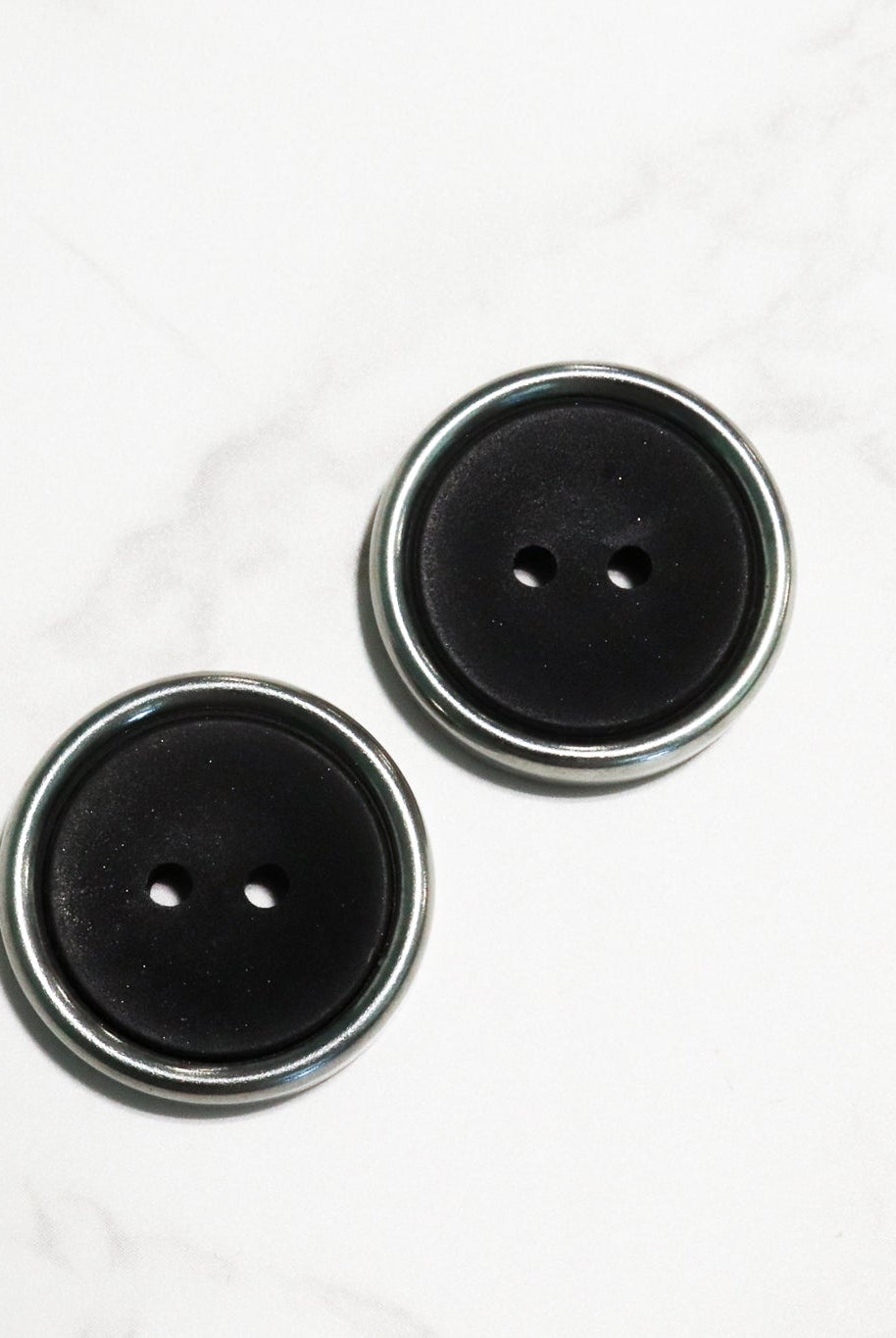 Black Plastic Two Hole Buttons with Metal Frame. Available in 23mm (36L) - Boho Fabrics - Buttons & Snaps