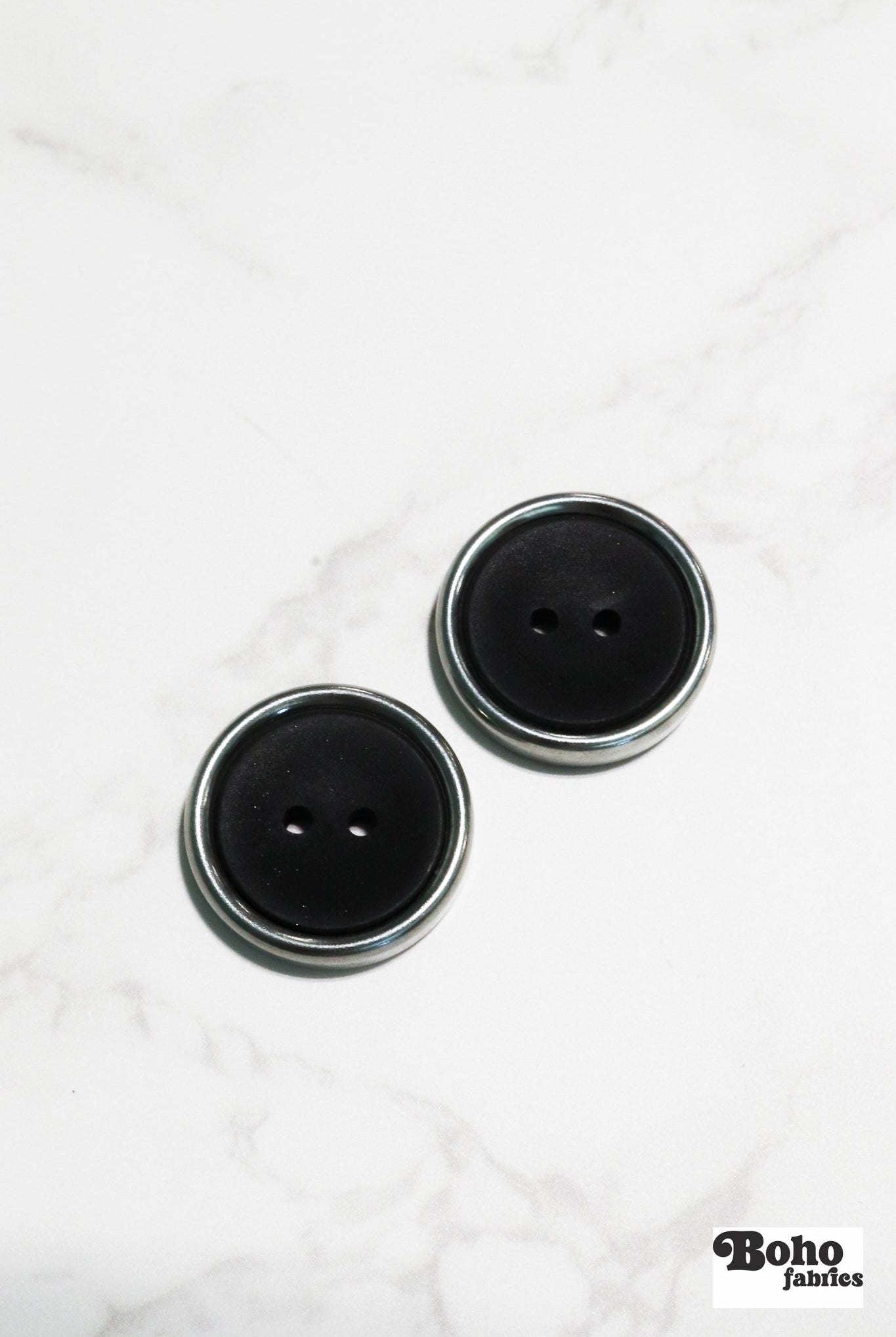 Black Plastic Two Hole Buttons with Metal Frame. Available in 23mm (36L) - Boho Fabrics - Buttons & Snaps