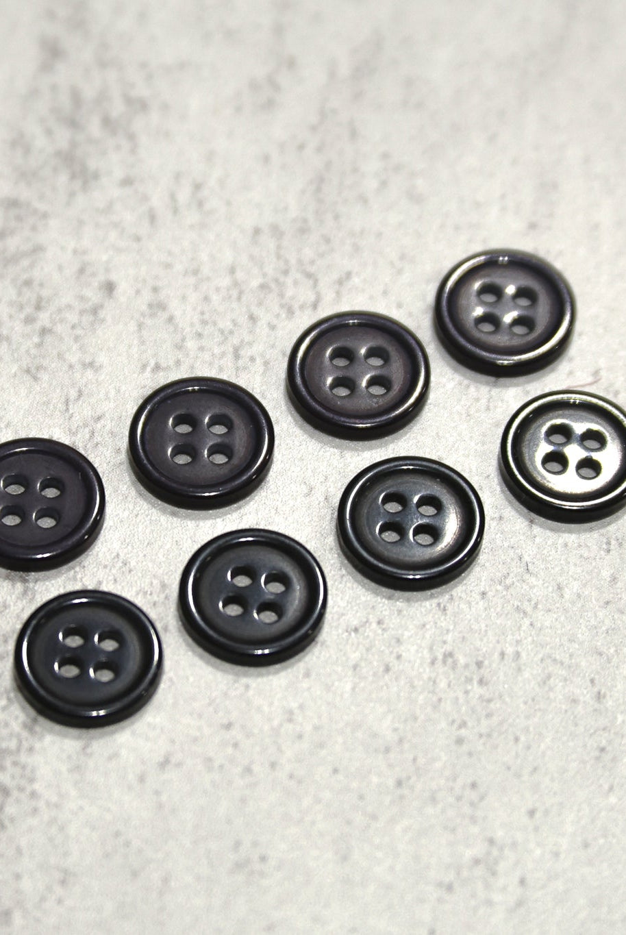 Black, Purple. Round 4 Hole Bevel Buttons. 18L (11.5mm/ 7/16") Sold per Package of 25 - Boho Fabrics - Buttons & Snaps