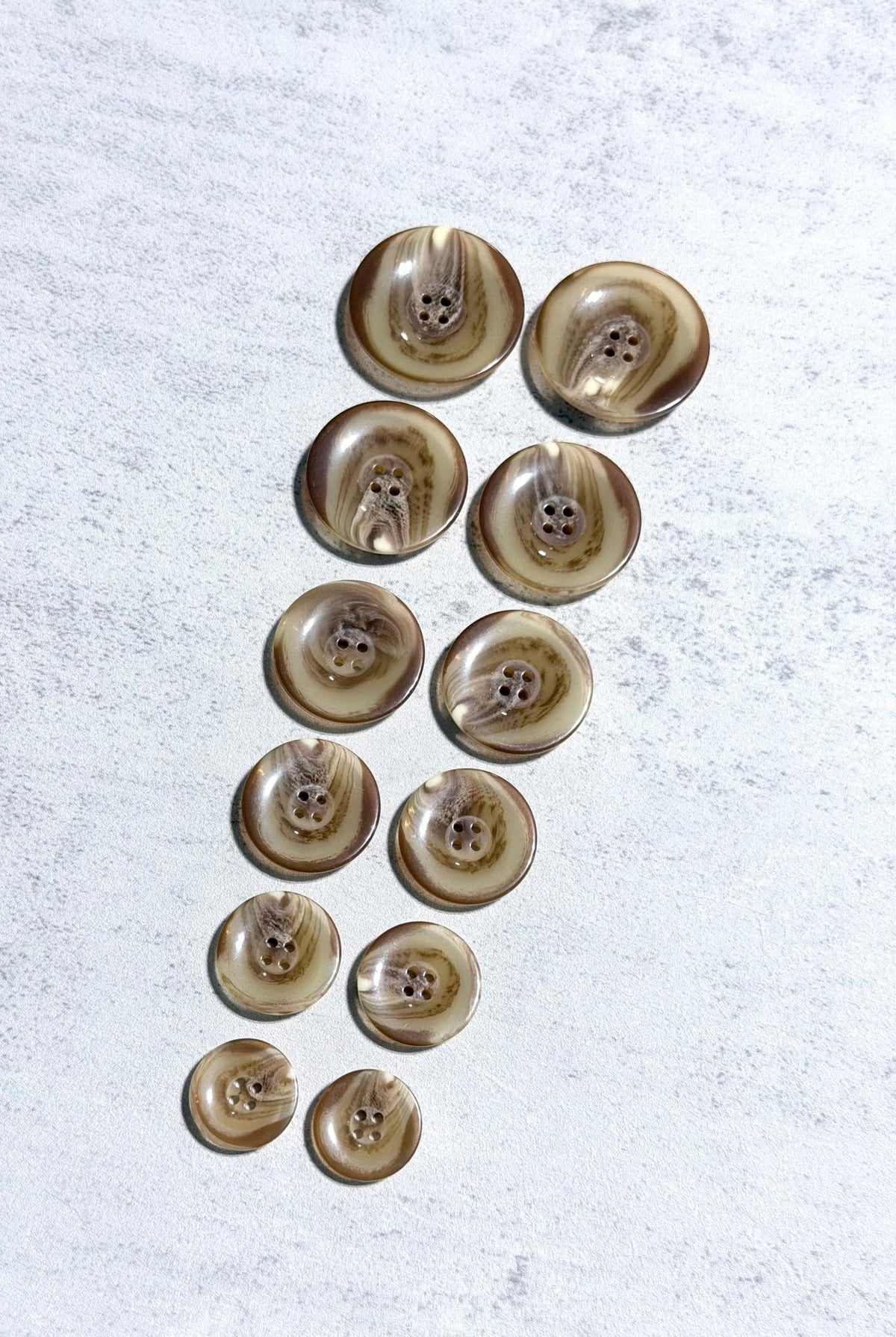 Glossy Beige Tortoiseshell Four Hole Plastic Buttons. 24L (15mm/ 5/8"), 28L, (18mm/ 11/16"), 32L (20mm / 13/16"), 36L (23mm, 7/8"), 40L (25mm/ 1"), 44L (28mm/ 1 1/8") - Boho Fabrics - Buttons & Snaps