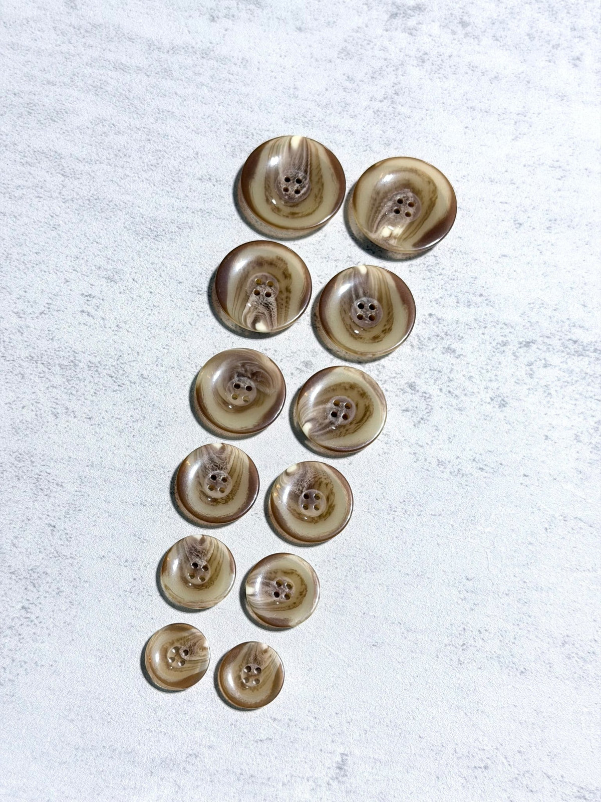 Glossy Beige Tortoiseshell Four Hole Plastic Buttons. 24L (15mm/ 5/8"), 28L, (18mm/ 11/16"), 32L (20mm / 13/16"), 36L (23mm, 7/8"), 40L (25mm/ 1"), 44L (28mm/ 1 1/8") - Boho Fabrics - Buttons & Snaps