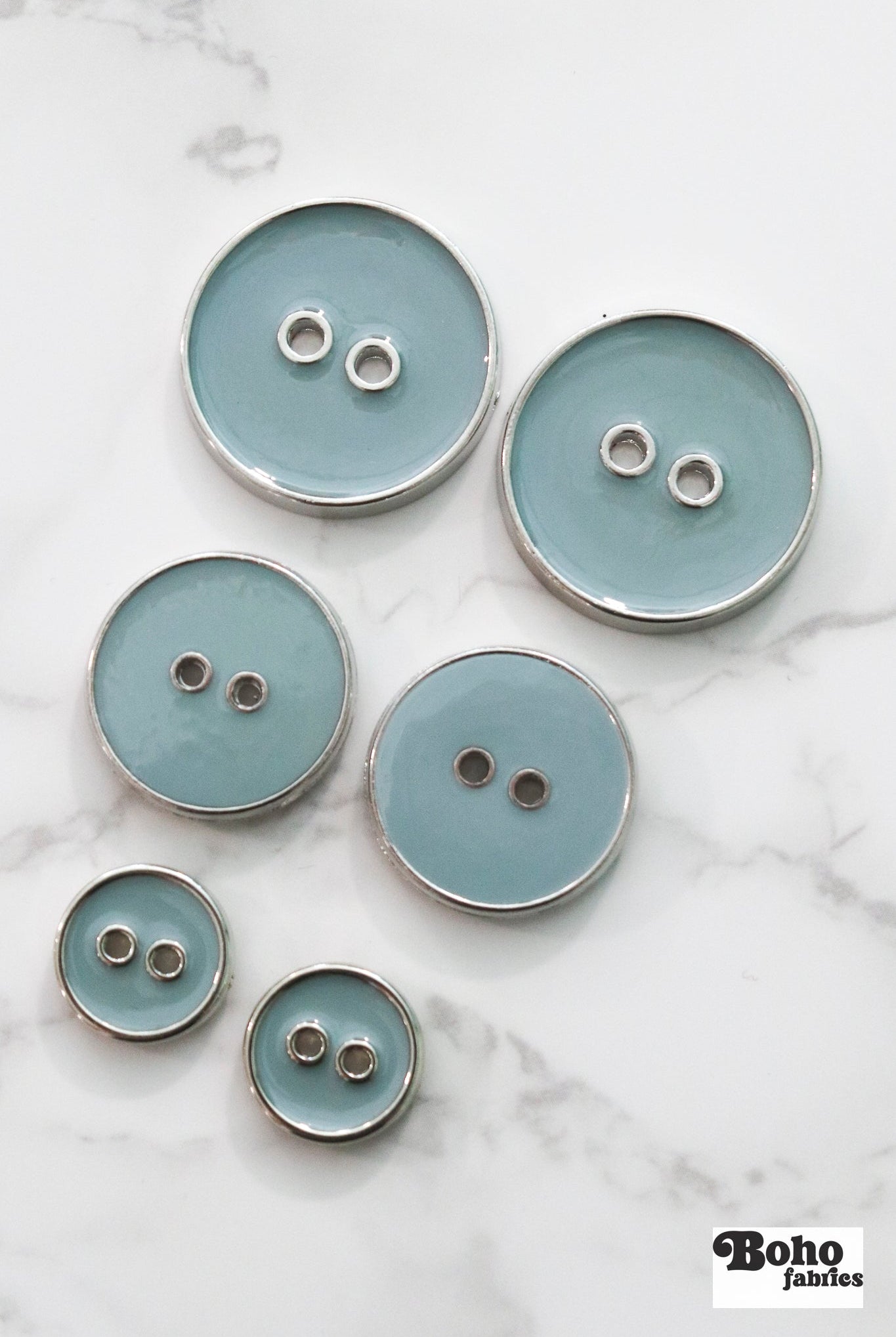 Pale Teal Silver Rimmed Two - hole Buttons. Available in 15mm (24L), 23mm (36L), and 28mm (44L) - Boho Fabrics - Buttons & Snaps