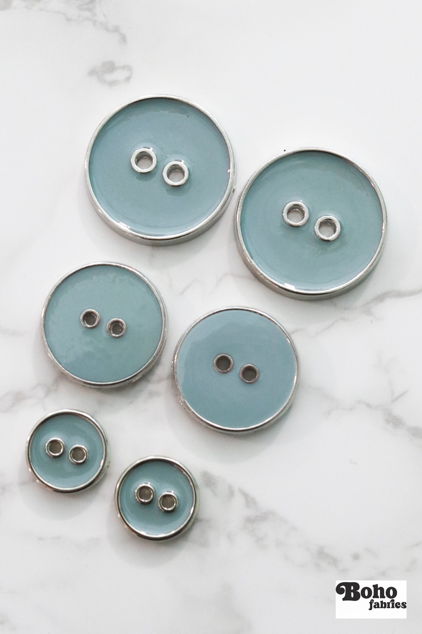 Pale Teal Silver Rimmed Two - hole Buttons. Available in 15mm (24L), 23mm (36L), and 28mm (44L) - Boho Fabrics - Buttons & Snaps