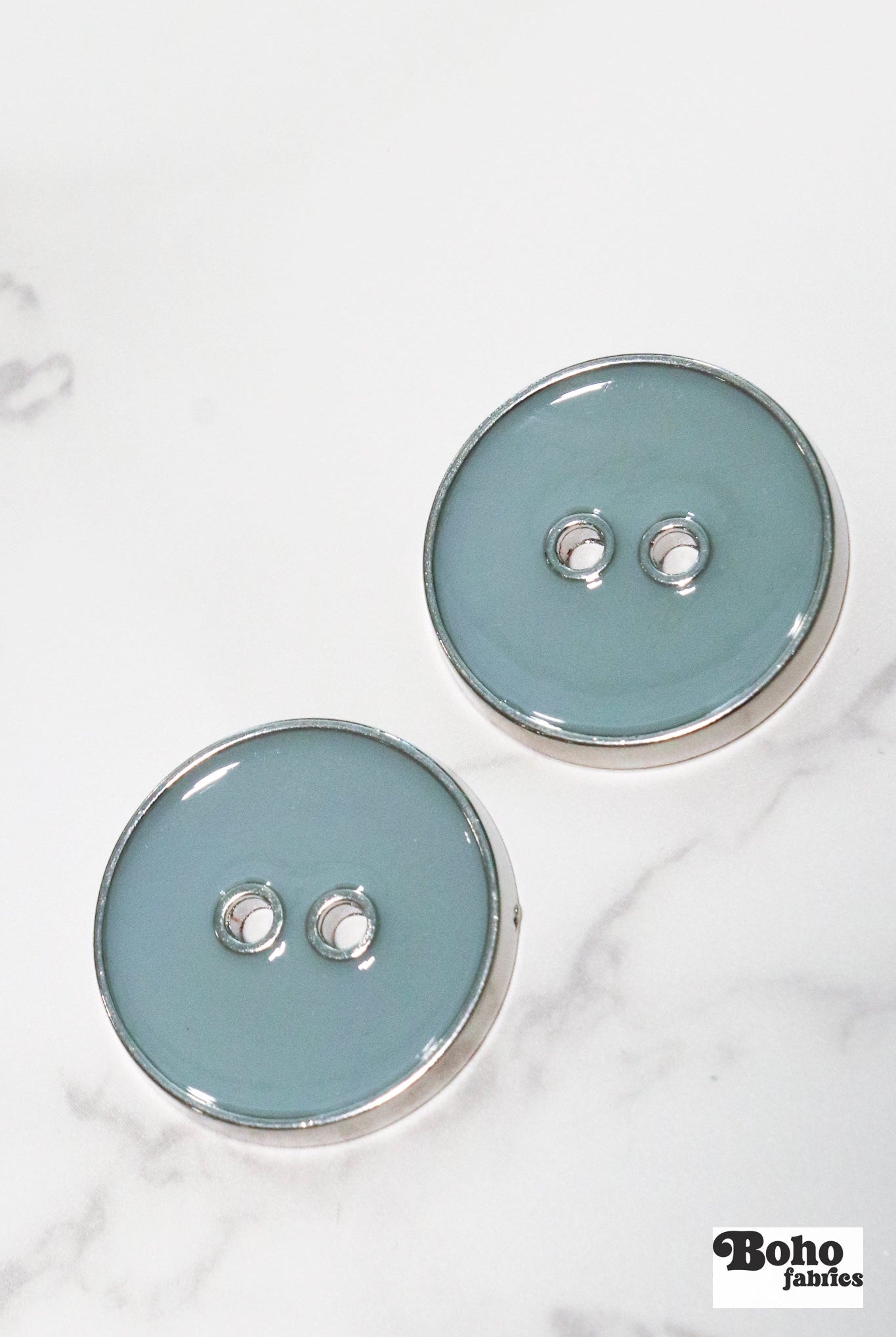 Pale Teal Silver Rimmed Two - hole Buttons. Available in 15mm (24L), 23mm (36L), and 28mm (44L) - Boho Fabrics - Buttons & Snaps