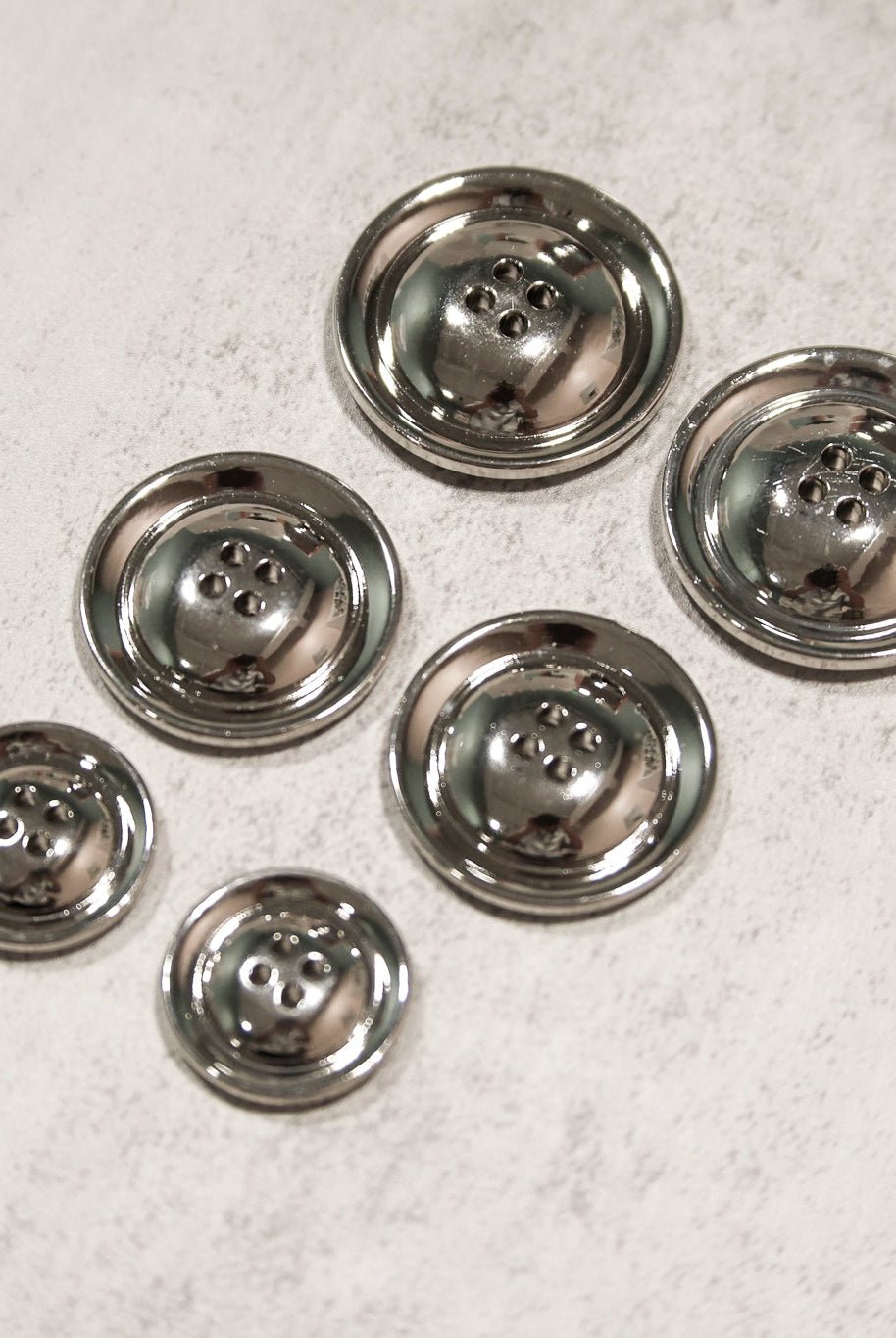 Silver, 4 Hole Plastic Buttons. 28L (18mm/11/16"), 36L (23mm/7/8"), 48L (30mm/ 1 1/4"), 54L (34mm/ 1 3/8") - Boho Fabrics - Buttons & Snaps