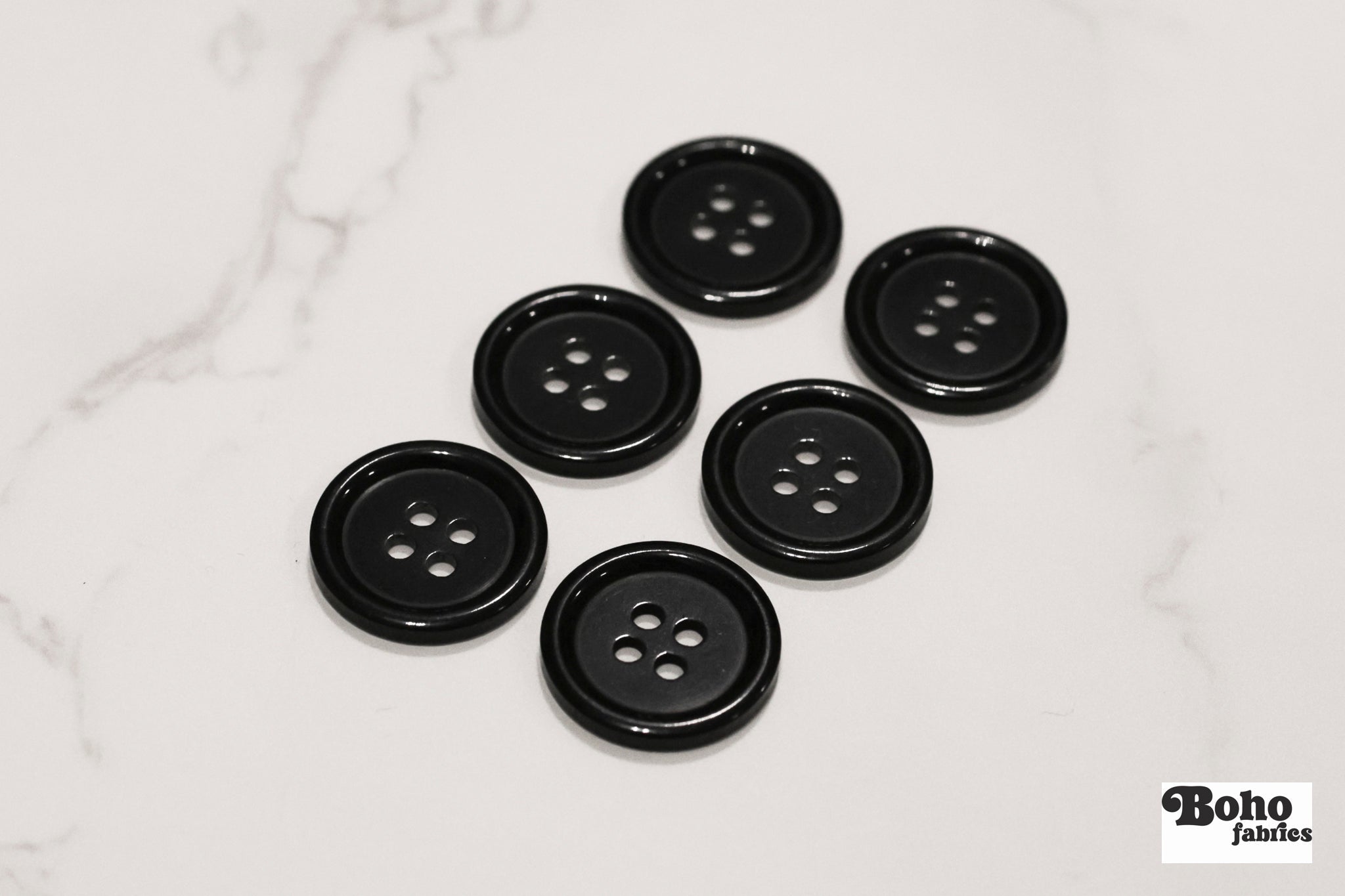 Black, 4 Hole Plastic Buttons. 28L (18mm/ 11/16") Sold per Package of 12. - Boho Fabrics - Buttons & Snaps