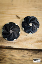 Black Floral Pinwheel on Silver Plastic Shank Button. Available in 17.8mm (28L), 21.6mm (34L) and 25.4mm (40L) - Boho Fabrics - Buttons & Snaps