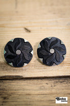 Black Floral Pinwheel on Silver Plastic Shank Button. Available in 17.8mm (28L), 21.6mm (34L) and 25.4mm (40L) - Boho Fabrics - Buttons & Snaps