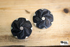 Black Floral Pinwheel on Silver Plastic Shank Button. Available in 17.8mm (28L), 21.6mm (34L) and 25.4mm (40L) - Boho Fabrics - Buttons & Snaps