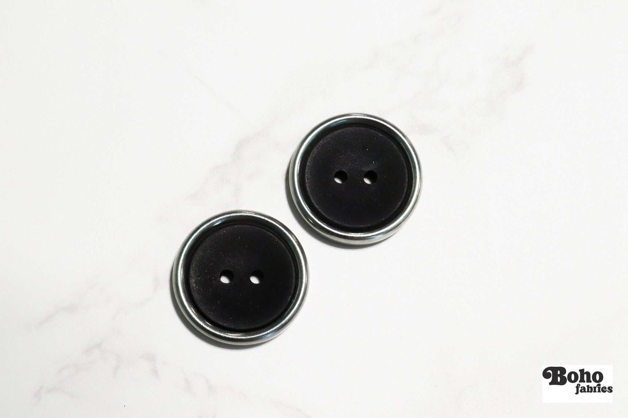Black Plastic Two Hole Buttons with Metal Frame. Available in 23mm (36L) - Boho Fabrics - Buttons & Snaps