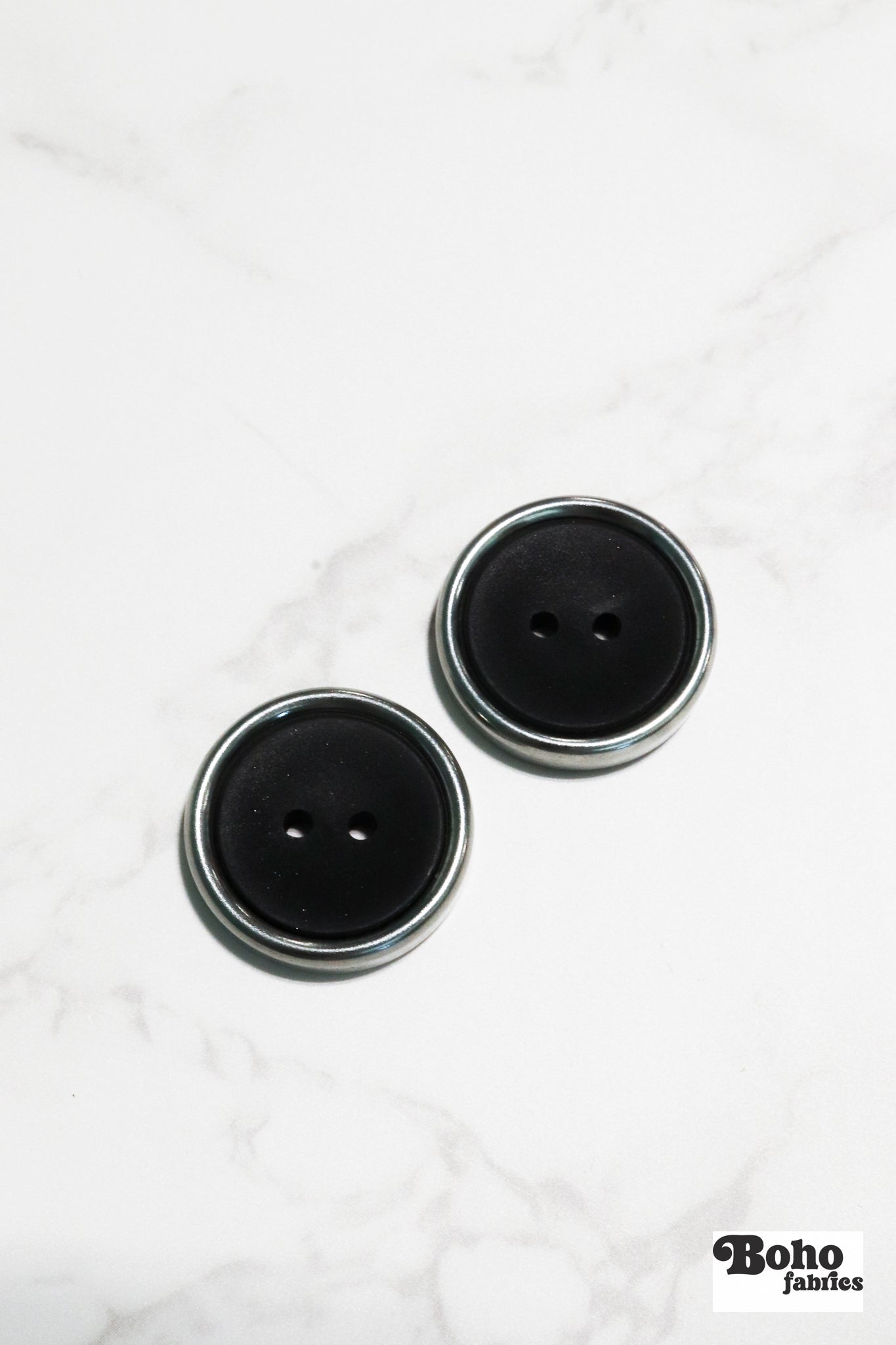 Black Plastic Two Hole Buttons with Metal Frame. Available in 23mm (36L) - Boho Fabrics - Buttons & Snaps