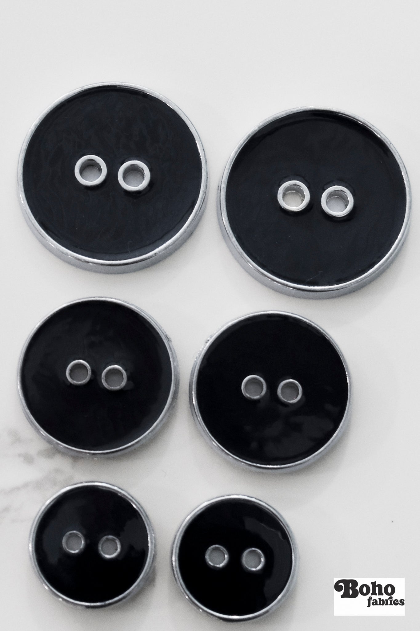 Black Silver Rimmed Two - hole Buttons. Available in 15mm (24L), 23mm (36L), and 28mm (44L) - Boho Fabrics - Buttons & Snaps