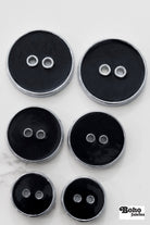 Black Silver Rimmed Two - hole Buttons. Available in 15mm (24L), 23mm (36L), and 28mm (44L) - Boho Fabrics - Buttons & Snaps