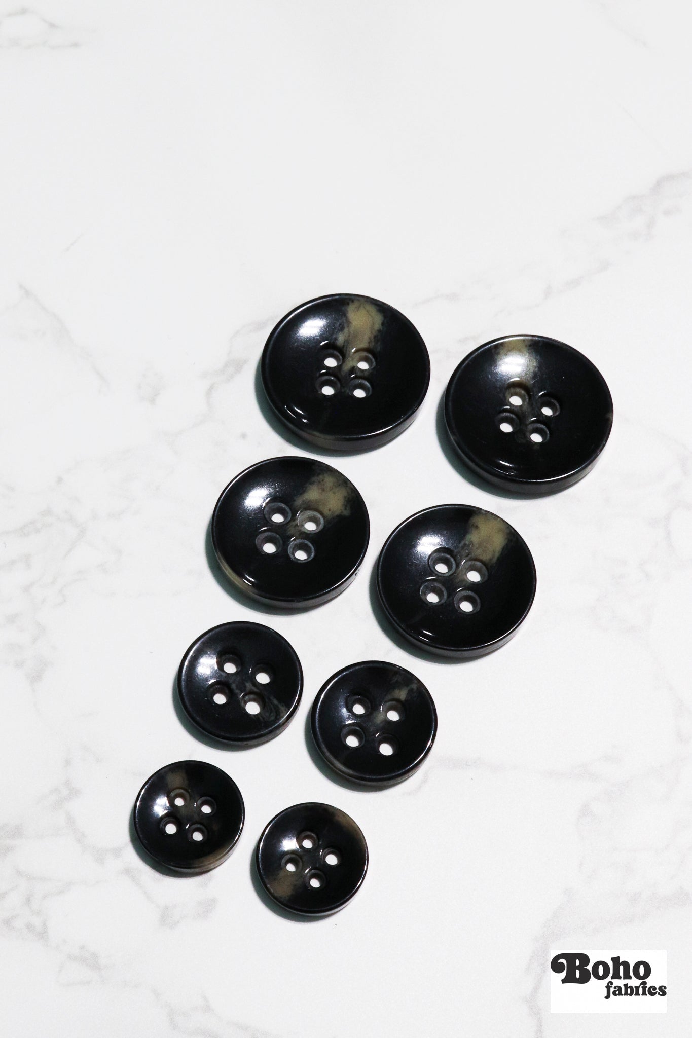 Black Tortoiseshell Round Plastic Four Hole Buttons. Available in 15mm (24L), 18mm (28L), 20mm (32L), and 28mm (44L) - Boho Fabrics - Buttons & Snaps