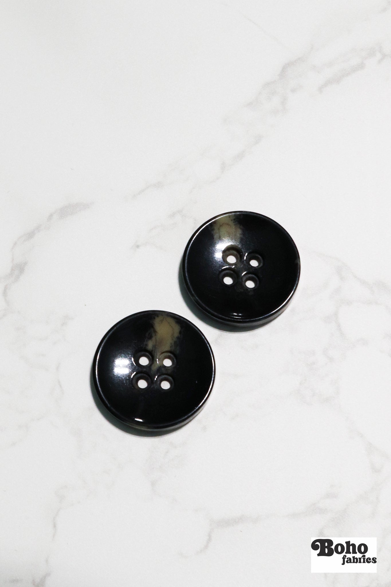 Black Tortoiseshell Round Plastic Four Hole Buttons. Available in 15mm (24L), 18mm (28L), 20mm (32L), and 28mm (44L) - Boho Fabrics - Buttons & Snaps