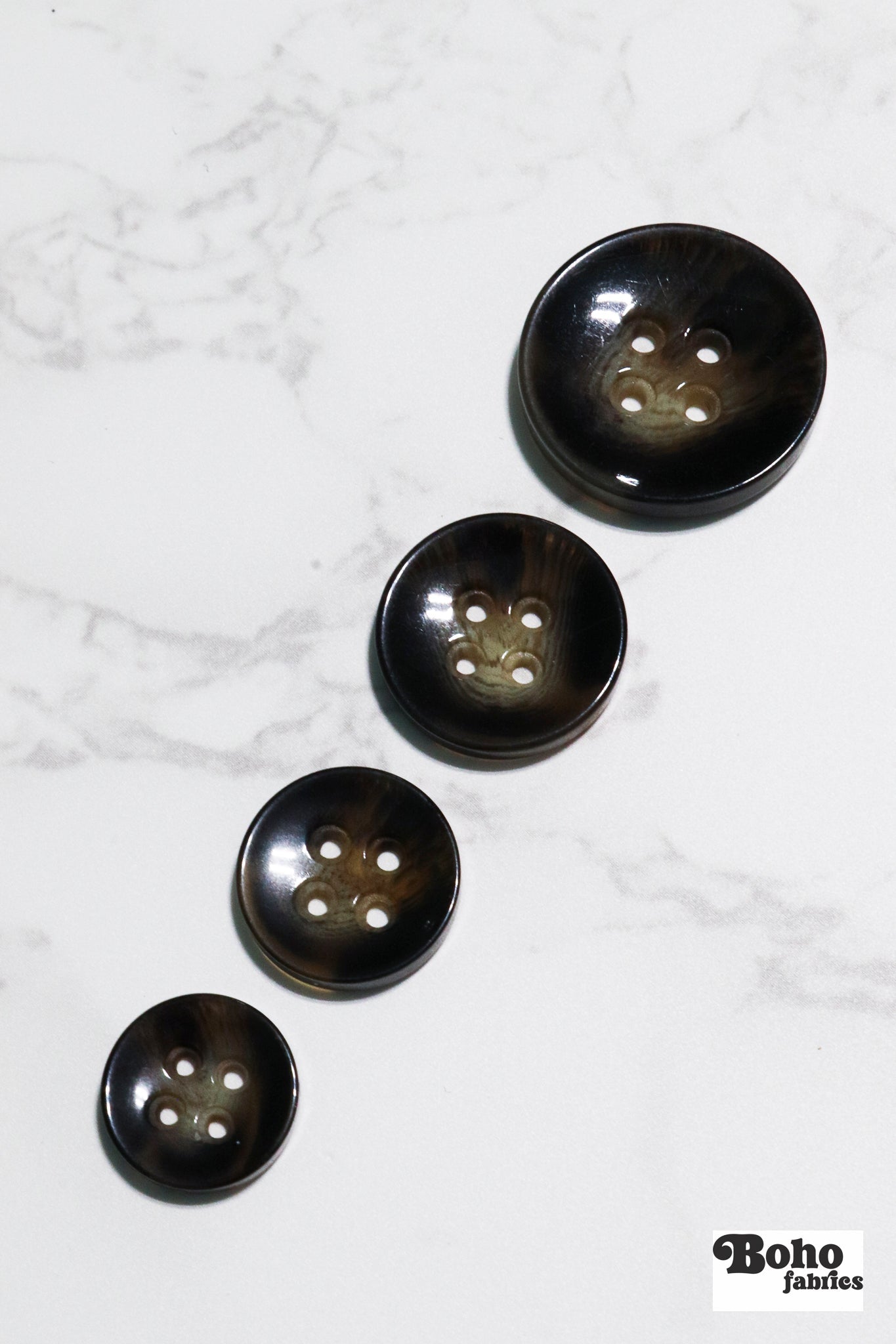 Brown Tortoiseshell Round Plastic Four Hole Buttons. Available in 15mm (24L), 18mm (28L), 20mm (32L), and 25mm (40L) - Boho Fabrics - Buttons & Snaps