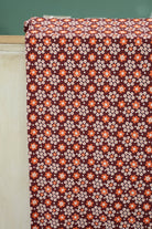 Carnaby Daisy in White & Orange on Brown, Athletic Knit Fabric (Small Flaw) - Boho Fabrics - Athletic Knit Fabric