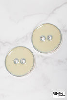 Eggshell Silver Rimmed Two - hole Buttons. Available in 15mm (24L), 19mm (30L), 23mm (36L), and 25mm (40L) - Boho Fabrics - Buttons & Snaps