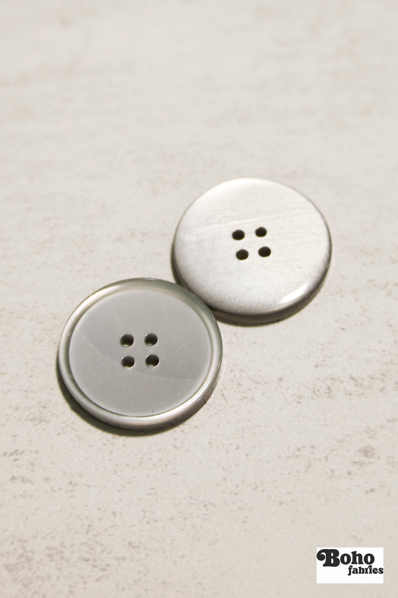 Glossy Silver/Gray Four Hole Plastic Buttons. 24L (15mm/ 5/8"), 28L, (18mm/ 11/16"), 32L (20mm / 13/16"), 36L (23mm, 7/8"), 40L (25mm/ 1"), 44L (28mm/ 1 1/8") - Boho Fabrics - Buttons & Snaps