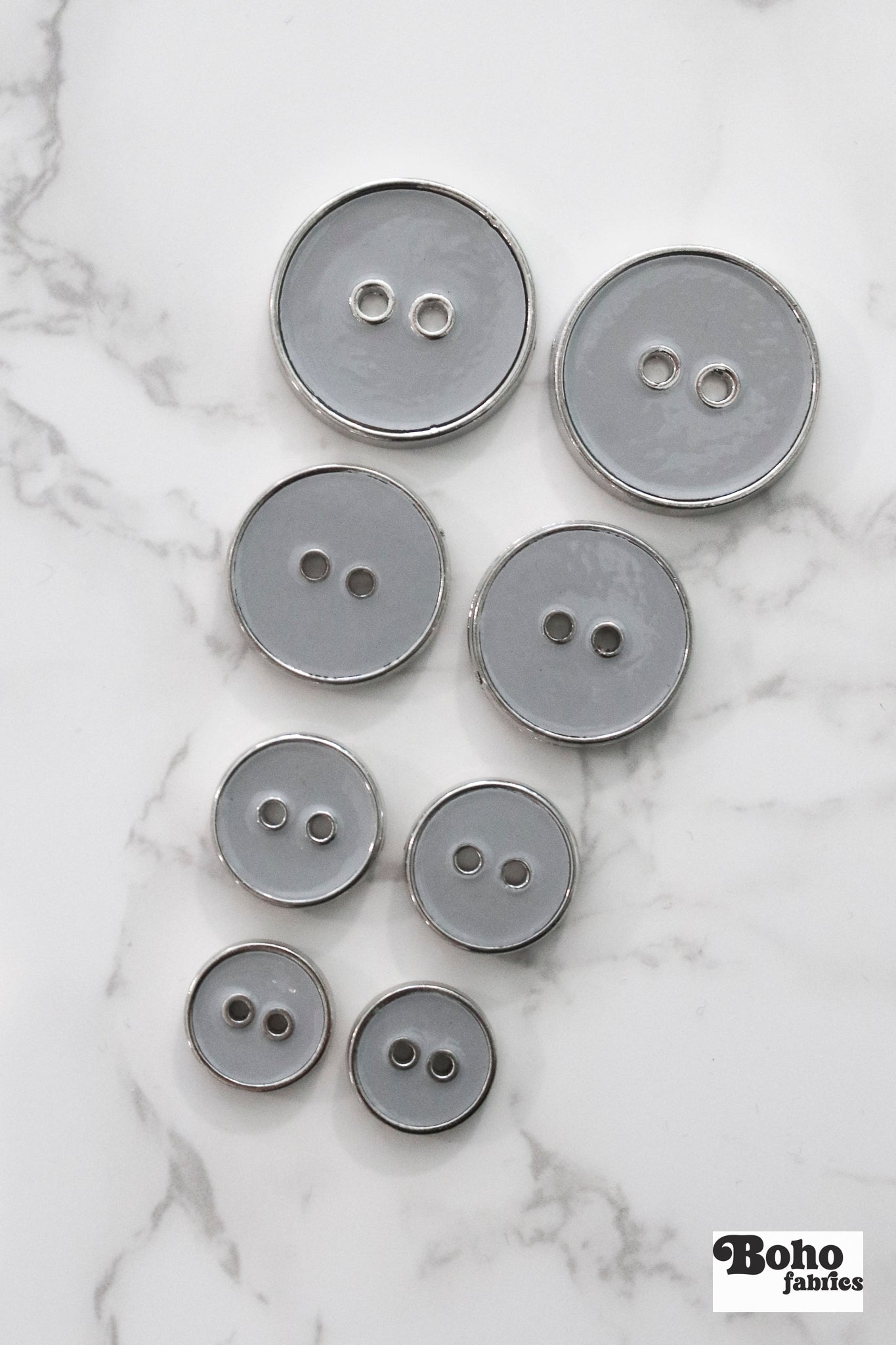 Light Gray Silver Rimmed Two - hole Buttons. Available in 12.5mm (20L), 15mm (24L), 23mm (36L), and 28mm (44L) (Copy) - Boho Fabrics - Buttons & Snaps