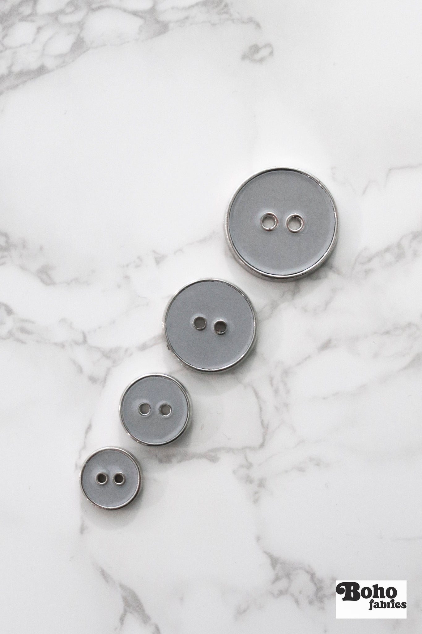 Light Gray Silver Rimmed Two - hole Buttons. Available in 12.5mm (20L), 15mm (24L), 23mm (36L), and 28mm (44L) (Copy) - Boho Fabrics - Buttons & Snaps