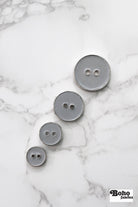 Light Gray Silver Rimmed Two - hole Buttons. Available in 12.5mm (20L), 15mm (24L), 23mm (36L), and 28mm (44L) (Copy) - Boho Fabrics - Buttons & Snaps