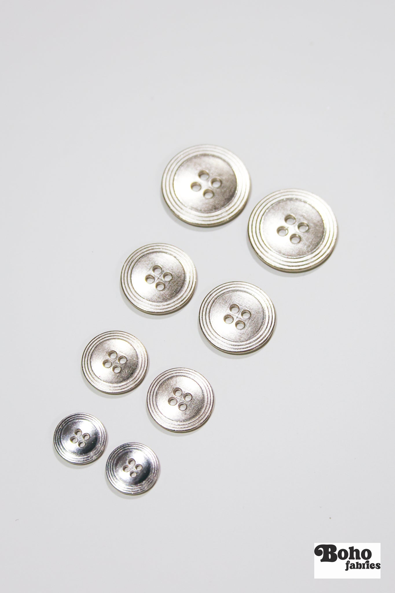 Nickel 4-Hole Buttons. 22L (14mm / 9/16"), 28L (18mm / 11/16"), 34L (21mm / 7/8"), 40L (25mm / 1") - Boho Fabrics - Buttons & Snaps