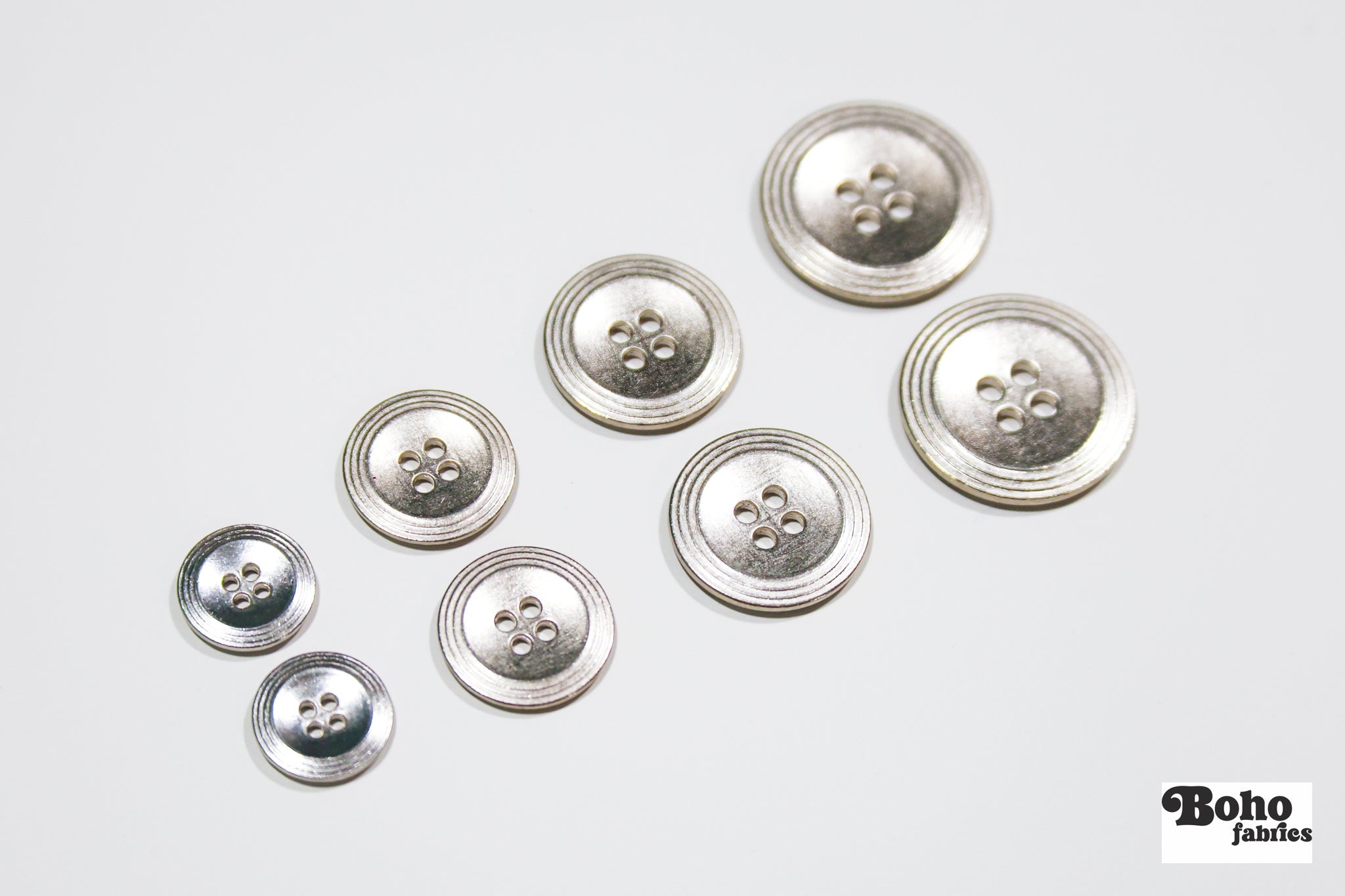 Nickel 4-Hole Buttons. 22L (14mm / 9/16"), 28L (18mm / 11/16"), 34L (21mm / 7/8"), 40L (25mm / 1") - Boho Fabrics - Buttons & Snaps