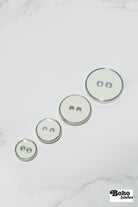 Off White Silver Rimmed Two - hole Buttons. Available in 12.5mm (20L), 15mm (24L), 19mm (30L), 23mm (36L) - Boho Fabrics - Buttons & Snaps