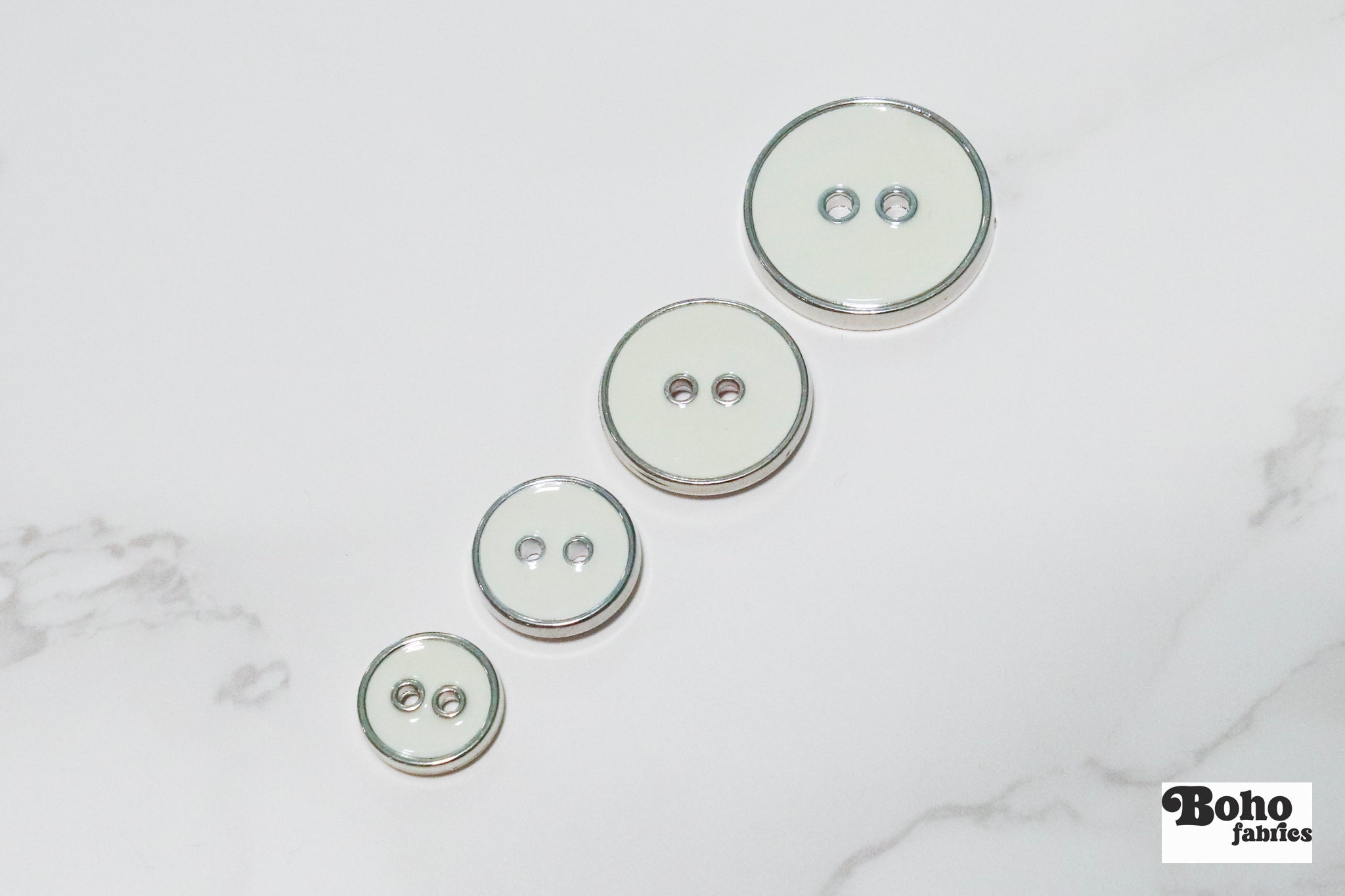 Off White Silver Rimmed Two - hole Buttons. Available in 12.5mm (20L), 15mm (24L), 19mm (30L), 23mm (36L) - Boho Fabrics - Buttons & Snaps