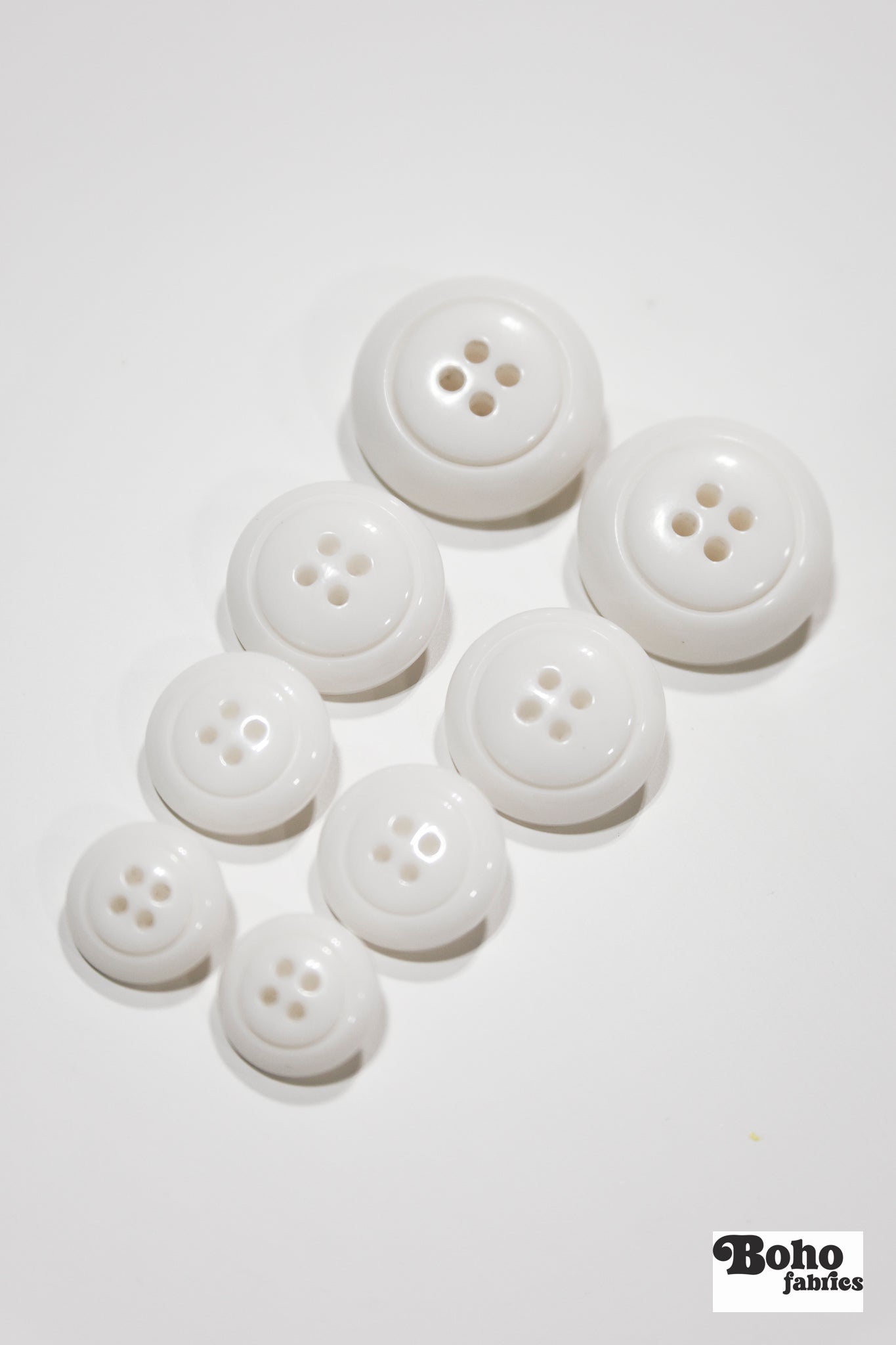White Dome 4-Hole Plastic Buttons. 28L (18mm / 11/16"), 34L (21mm / 7/8"), 40L (25mm / 1"), 48L (30mm / 1 3/16") - Boho Fabrics - Buttons & Snaps