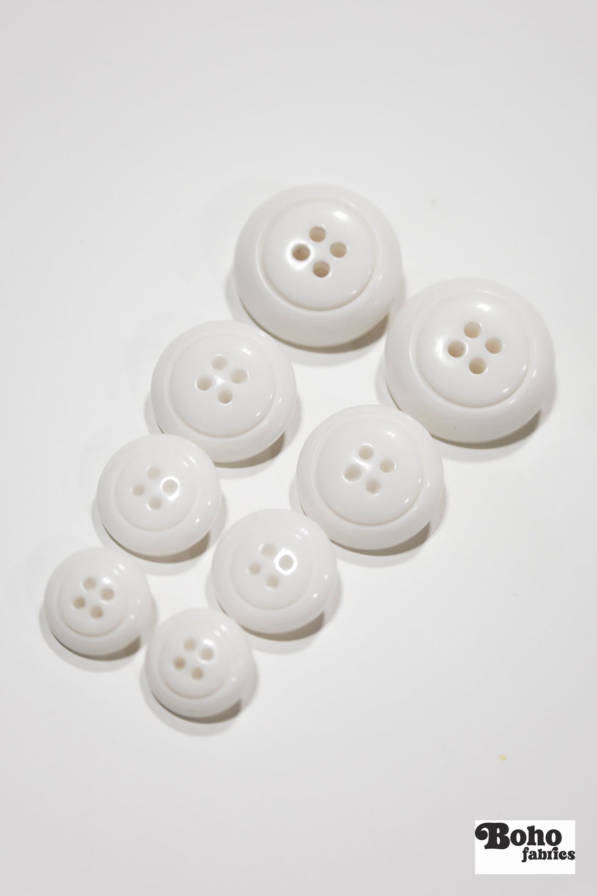 White Dome 4-Hole Plastic Buttons. 28L (18mm / 11/16"), 34L (21mm / 7/8"), 40L (25mm / 1"), 48L (30mm / 1 3/16") - Boho Fabrics - Buttons & Snaps
