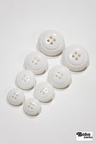 White Dome 4-Hole Plastic Buttons. 28L (18mm / 11/16"), 34L (21mm / 7/8"), 40L (25mm / 1"), 48L (30mm / 1 3/16") - Boho Fabrics - Buttons & Snaps