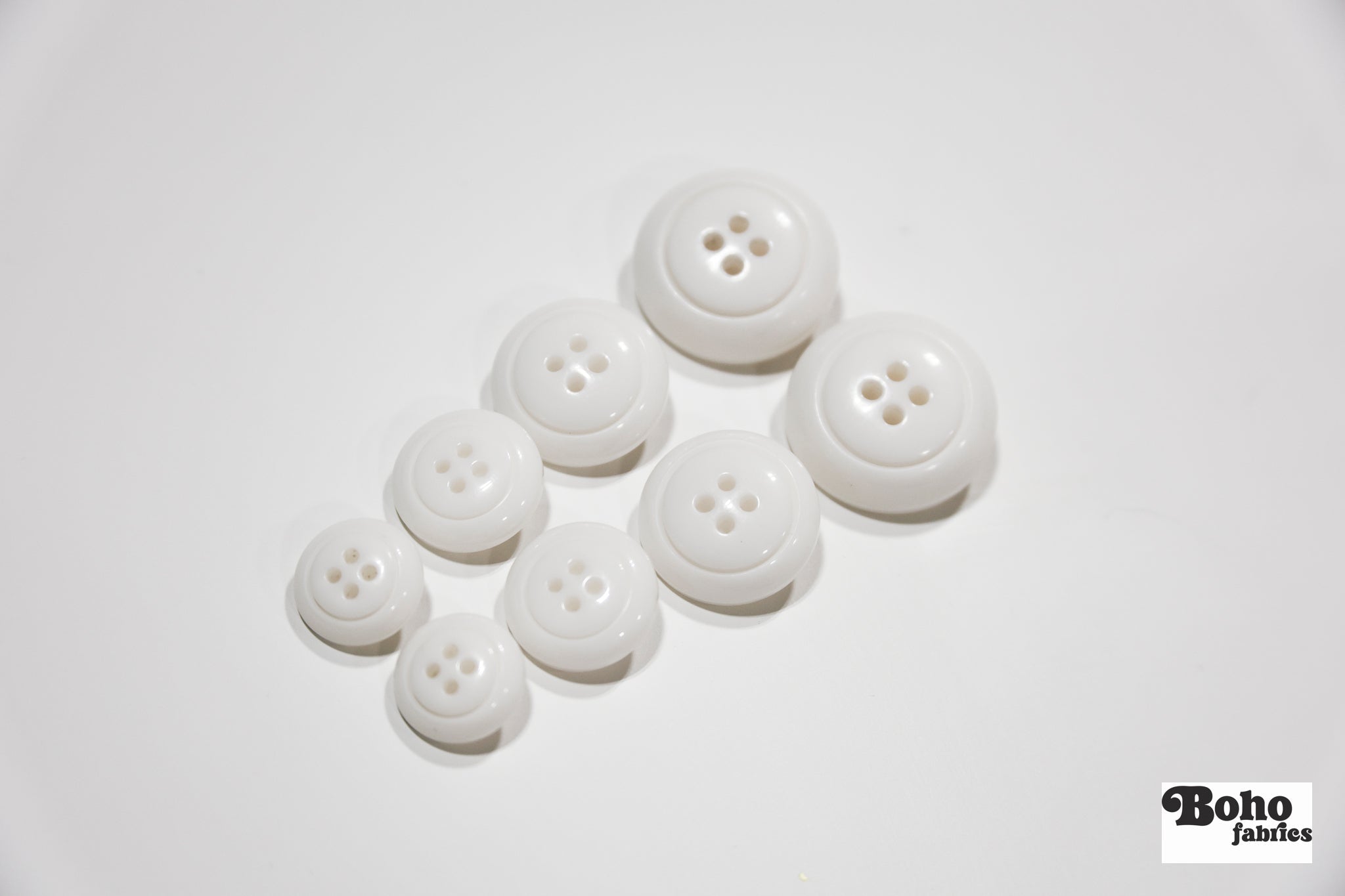 White Dome 4-Hole Plastic Buttons. 28L (18mm / 11/16"), 34L (21mm / 7/8"), 40L (25mm / 1"), 48L (30mm / 1 3/16") - Boho Fabrics - Buttons & Snaps